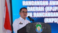 Kepala Bappeda Bombana Husrifnah Rahim saat menyampaikan sambutannya